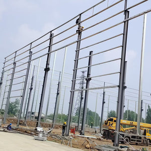 Portal frame factory building with crane