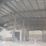 Portal frame factory building with crane