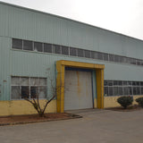 Portal frame factory building with crane