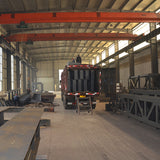 Portal frame factory building with crane